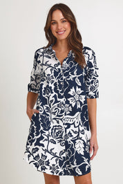 Model Madeline wearing size 10 of the Vine Linen Shirtmaker Dress in colour Vine (Blue), from the front, cropped image