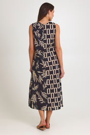 Model Madeline wearing size 10 of the Spliced Cotton Maxi Dress in colour Leaf (Black), from the back