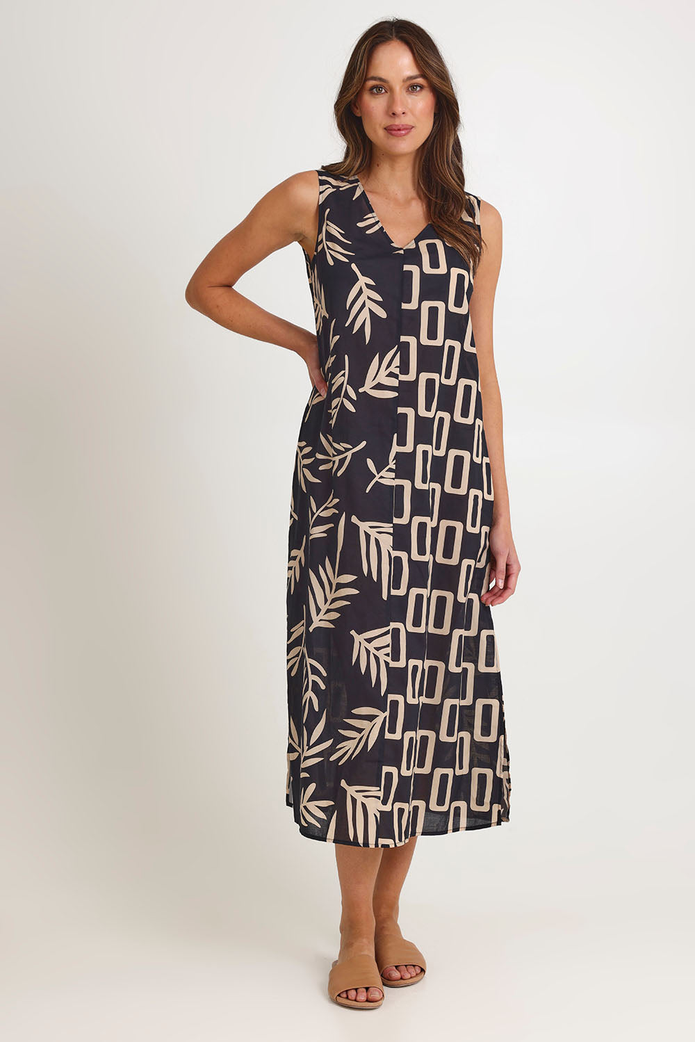 Model Madeline wearing size 10 of the Spliced Cotton Maxi Dress in colour Leaf (Black), from the front, showing the whole outfit