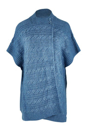 Product shot of the Lambswool Blend Cable Poncho in colour Denim (Blue), from the front