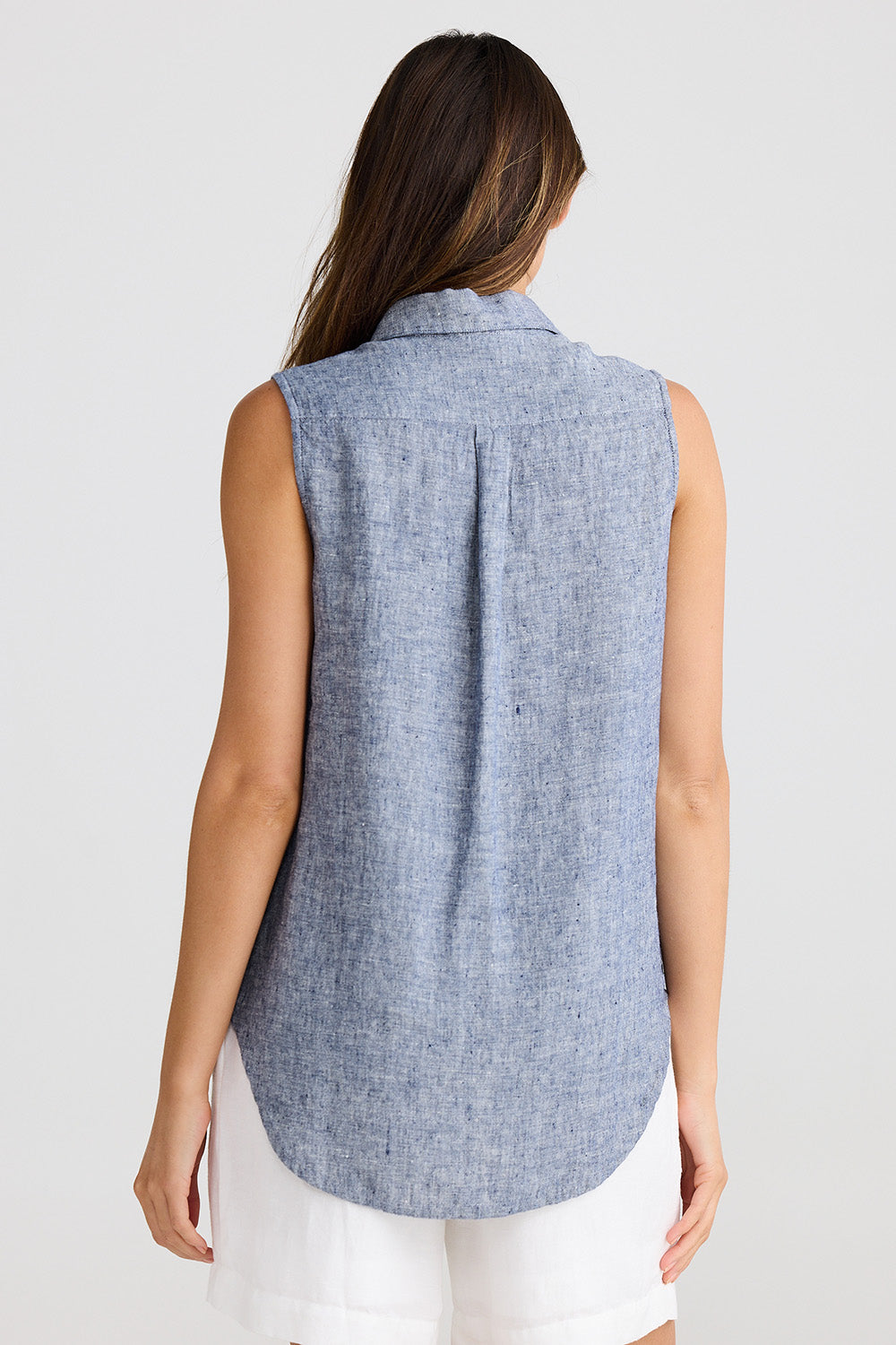 A model wearing the Bazzar Linen Top in colour Navyflick (Blue), from the back