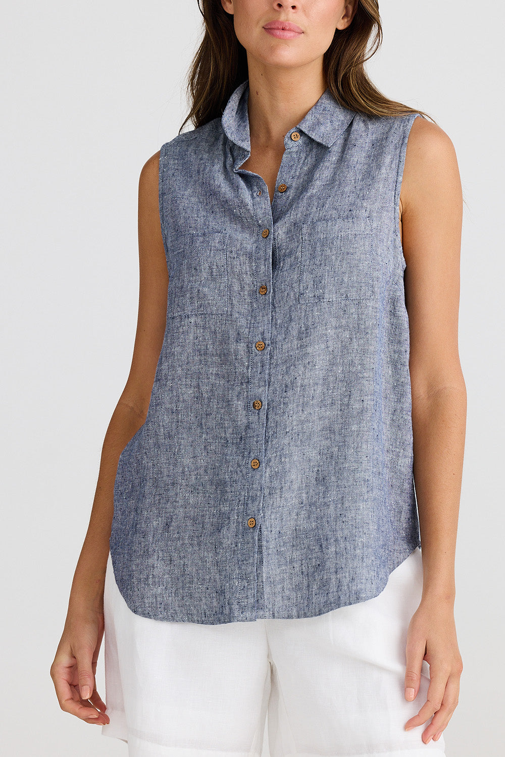 A model wearing the Bazzar Linen Top in colour Navyflick (Blue), from the front, cropped image