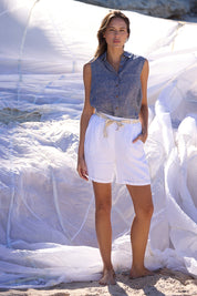 A model wearing the Bazzar Linen Top in colour Navyflick (Blue), from the front, showing the whole outfit