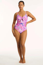 A model wearing the Tie Front Dd/E One Piece in colour Pink (Pink), from the front, showing the whole outfit