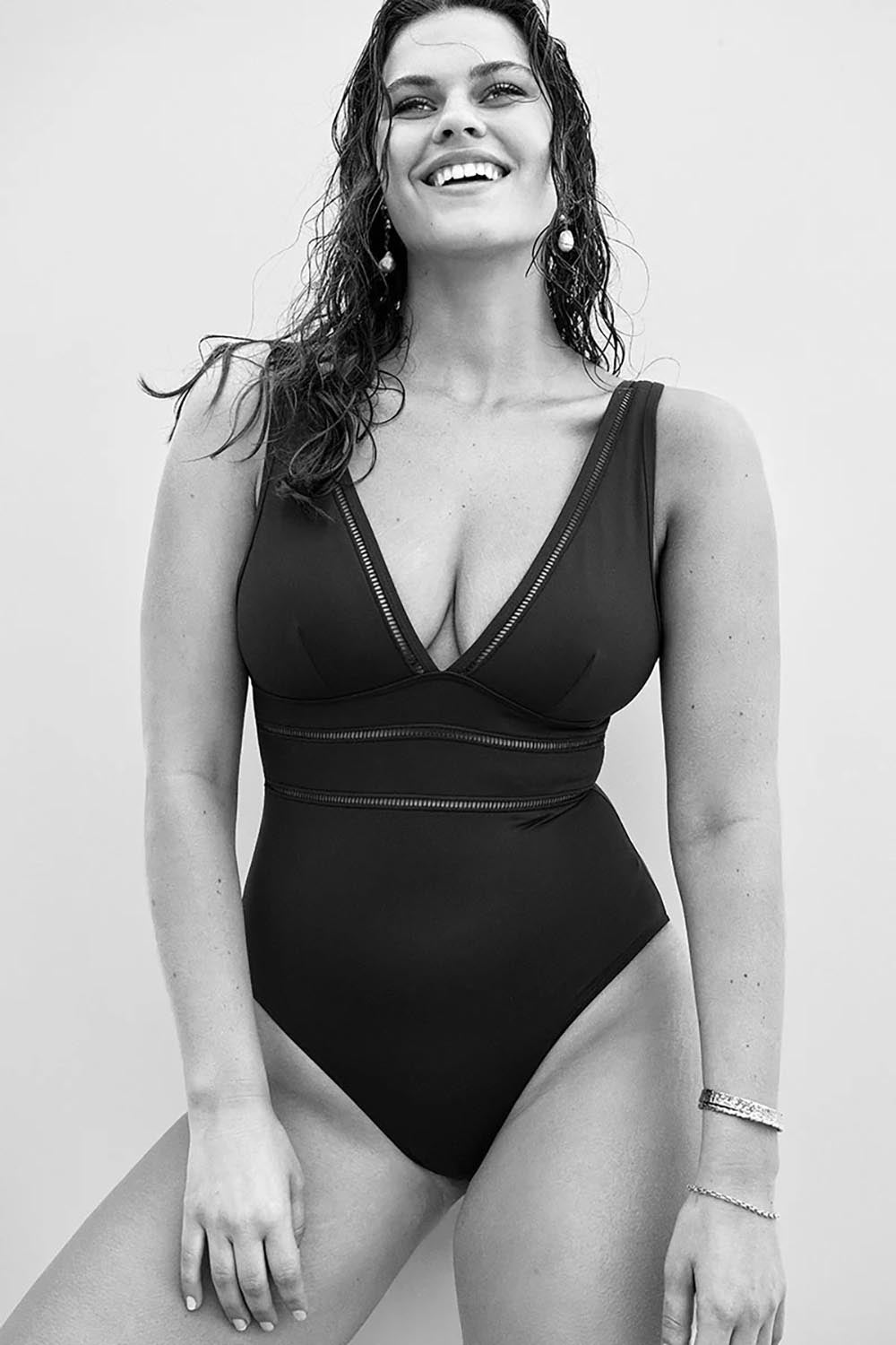 A model wearing the Spliced One Piece in colour Black (Black), from the front, showing the whole outfit