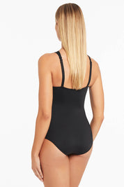 A model wearing the High Neck Multifit One Piece in colour Black (Black), from the back