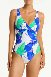 A model wearing the Cross Front Multifit One Piece in colour Cobalt (Blue), from the front, cropped image