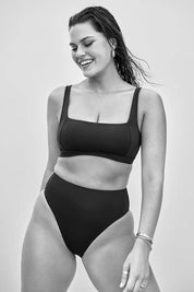 A model wearing the Square Neck Bra Top in colour Black (Black), from the front, showing the whole outfit