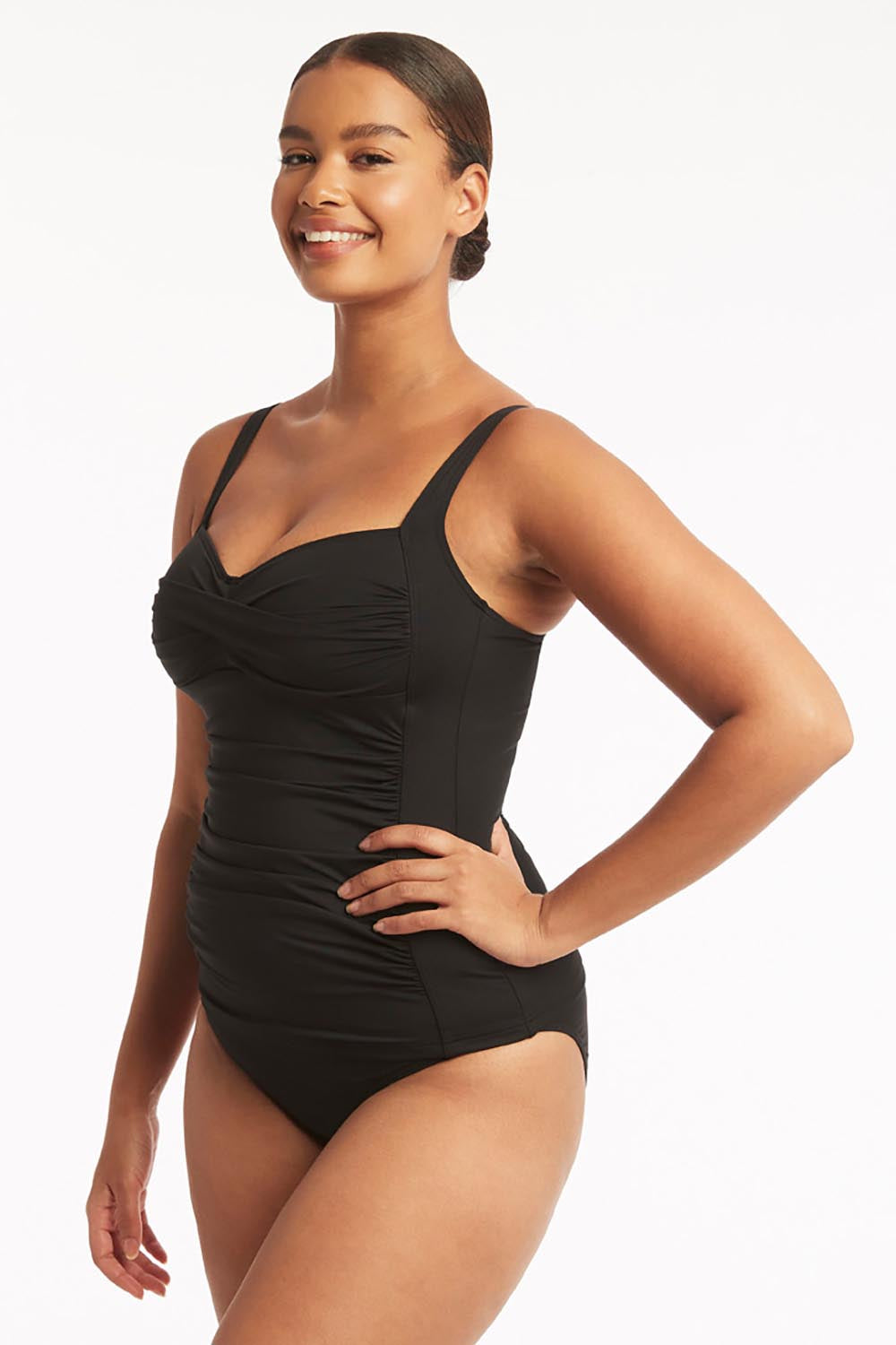 A model wearing the Twist Front Multifit Singlet Top in colour Black (Black), from the front, cropped image