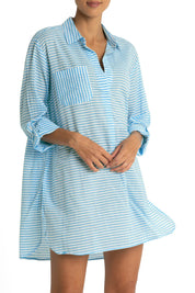 A model wearing the Summer Stripe Painters Shirt in colour Teal (Green), from the front, cropped image