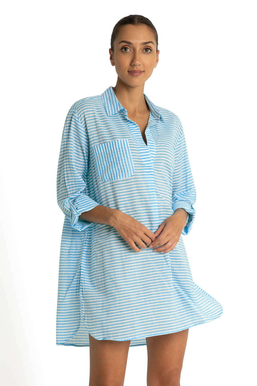 A model wearing the Summer Stripe Painters Shirt in colour Teal (Green), from the front, cropped image