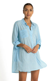 A model wearing the Summer Stripe Painters Shirt in colour Teal (Green), from the front, cropped image