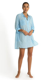 A model wearing the Summer Stripe Painters Shirt in colour Teal (Green), from the front, showing the whole outfit