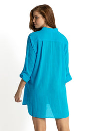 A model wearing the Resort Painters Shirt in colour Teal (Blue), from the back