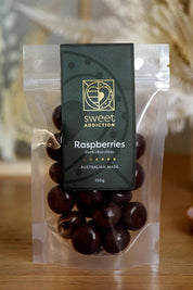 A model wearing the 150G Dark Chocolate Raspberries in colour Darkrasp, from the front, showing the whole outfit