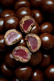 A model wearing the 150G Dark Chocolate Raspberries in colour Darkrasp, from the front, showing the whole outfit