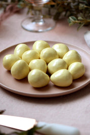 A model wearing the 100G White Chocolate Freeze Dried Strawberries in colour Strawberry (White), from the front, showing the whole outfit