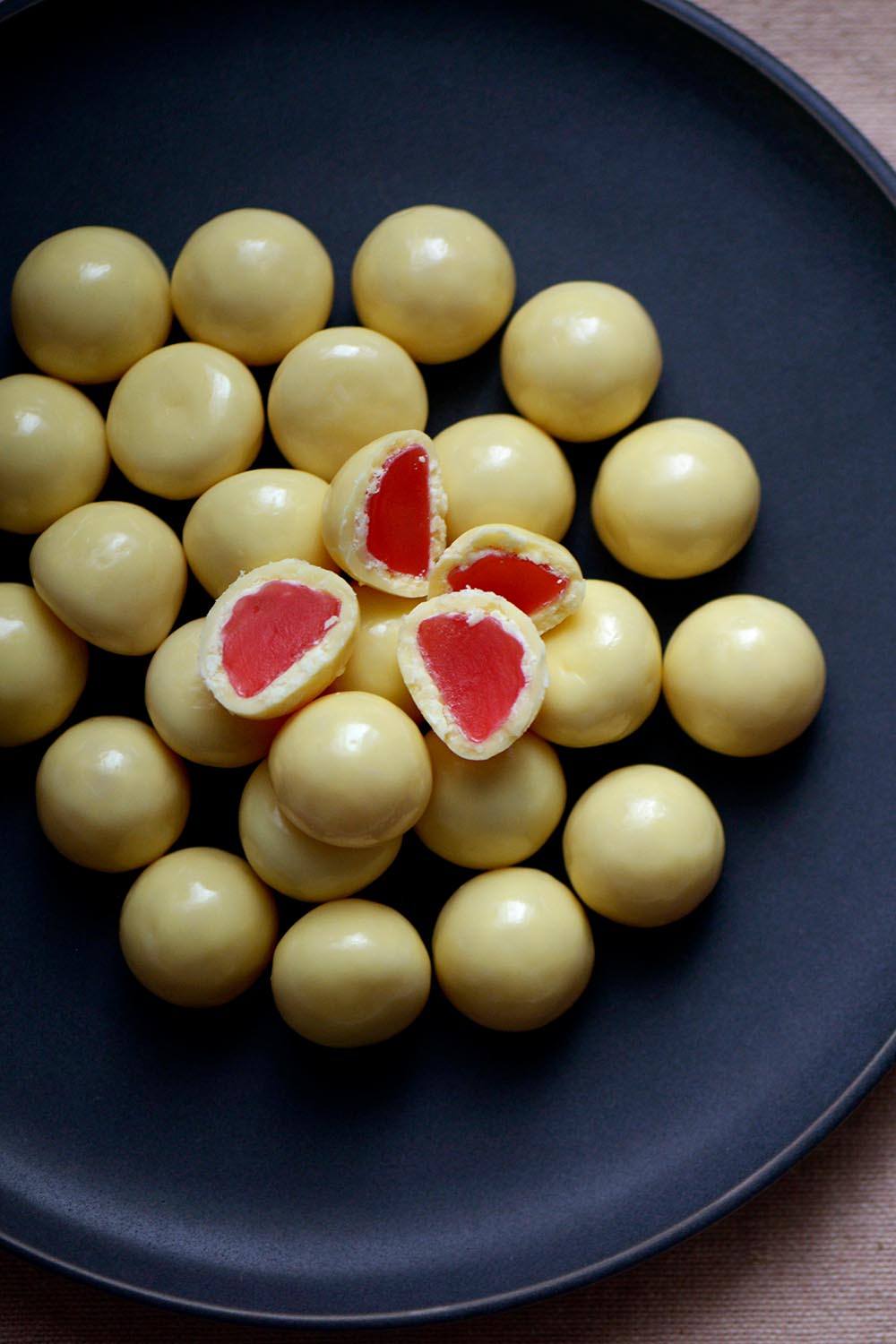 Product shot of the 150g White Chocolate Raspberries - Whiterasp in colour Whiterasp, from the back