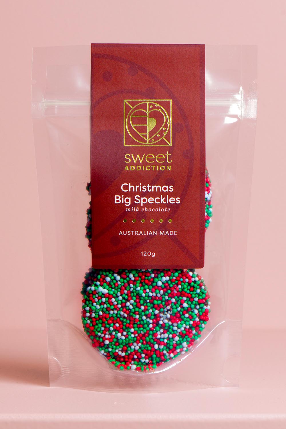 Product shot of the Red Label 120g Christmas Big Speckles - Specklegreenred in colour Specklegreenred, from the front