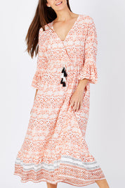 Model Anna wearing size S of the Aurora Dress in colour Wanderer, from the front, cropped image