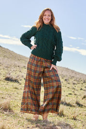 Model Katie wearing size S of the Freedom Pant in colour Highlands, from the front, showing the whole outfit