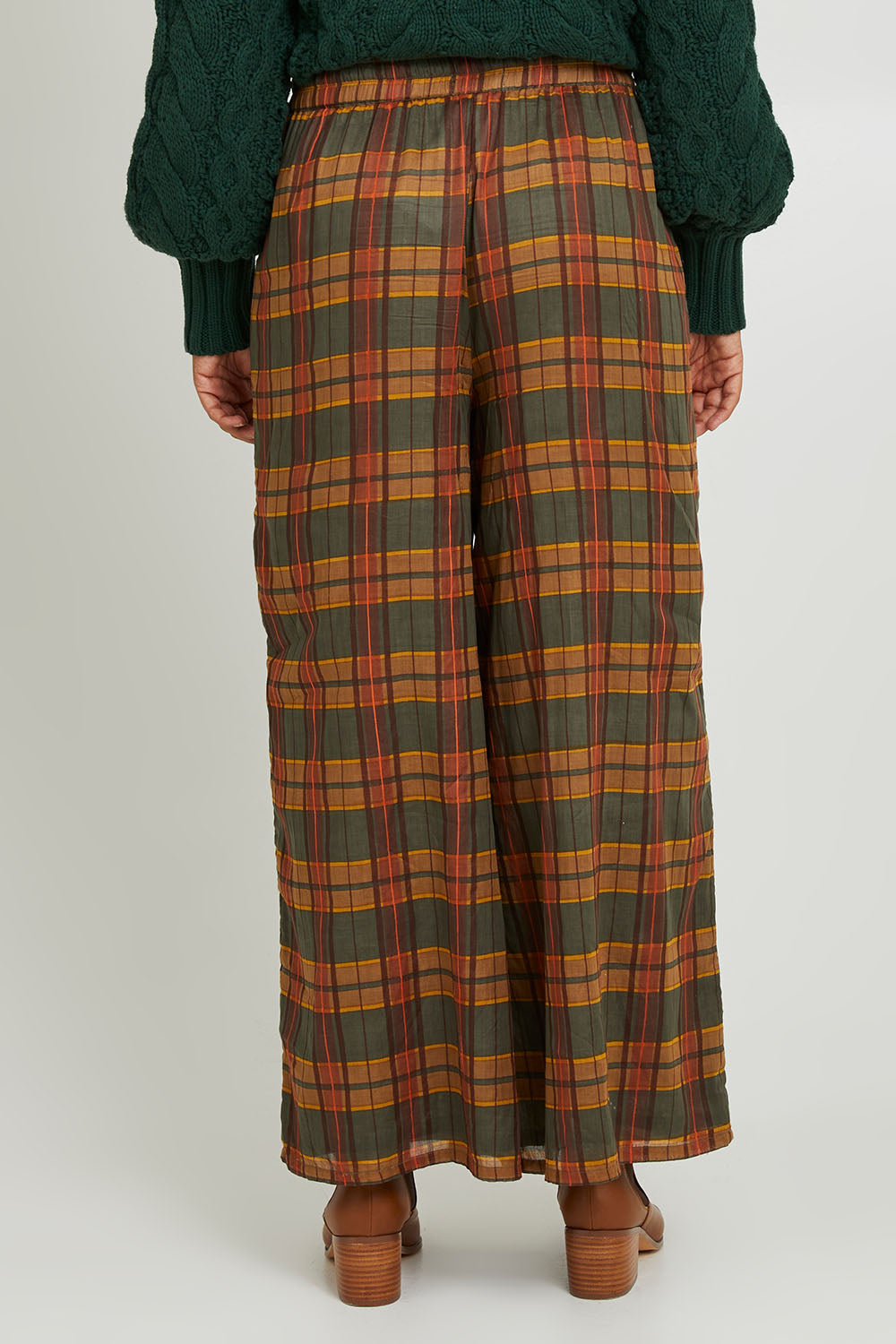 Model Olivia wearing size S of the Freedom Pant in colour Highlands, from the back