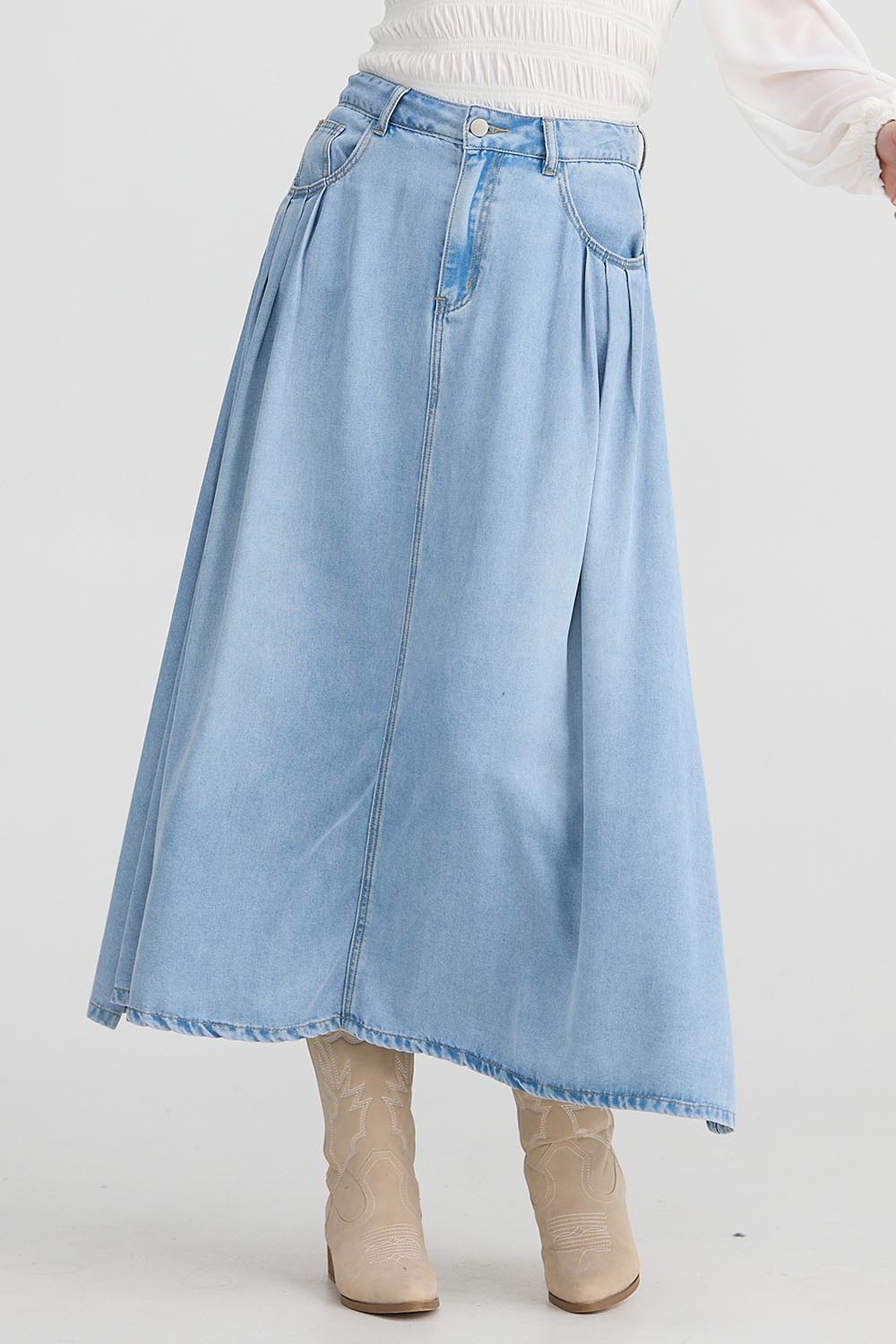 A model wearing the Austin Skirt in colour Lightblue (Blue), from the front, cropped image