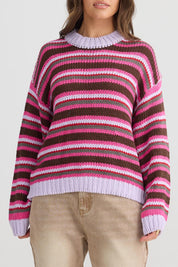 A model wearing the All Sorts Knit in colour Lilacstrip, from the front, cropped image