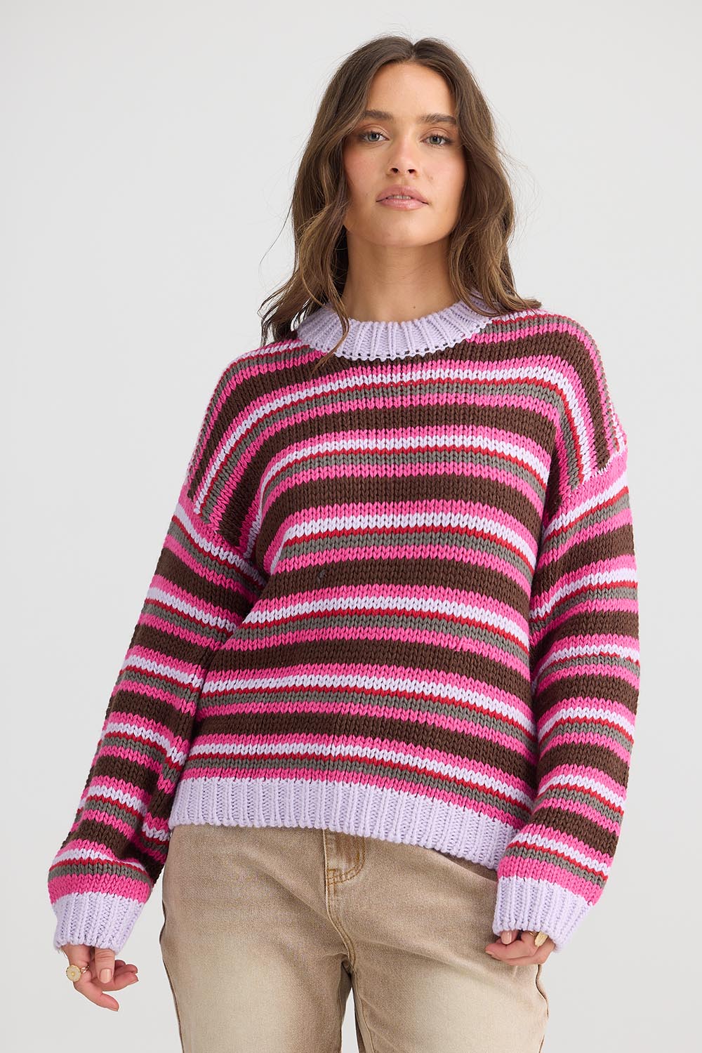 A model wearing the All Sorts Knit in colour Lilacstrip, from the front, cropped image