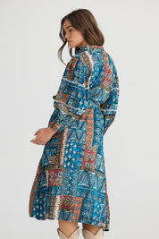 A model wearing the Castella Cotton Dress in colour Sicilian (Blue), from the back
