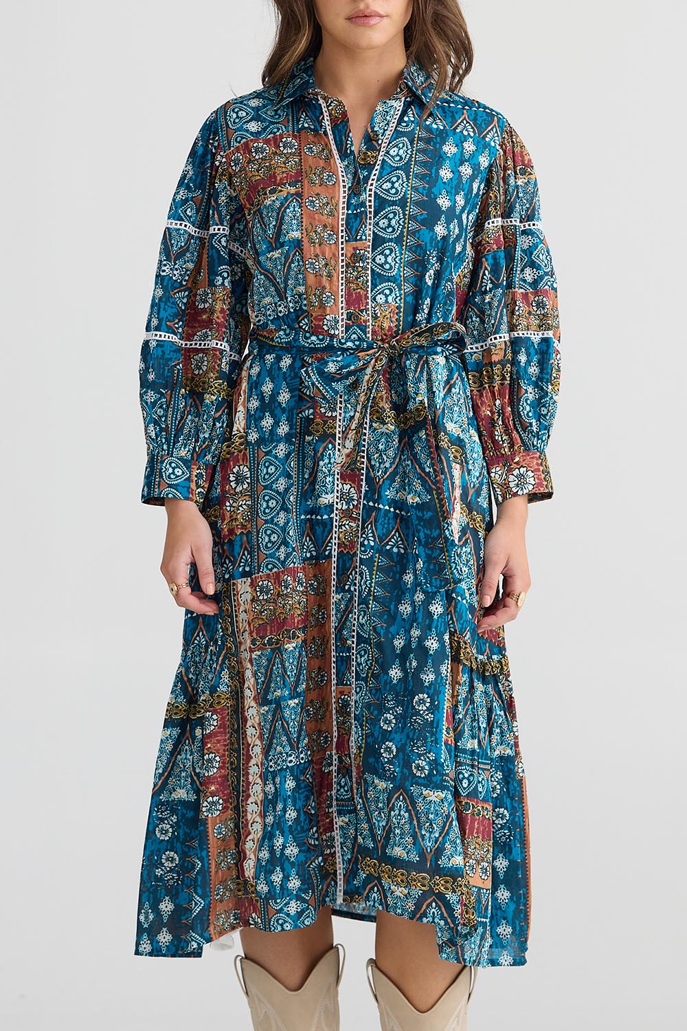 A model wearing the Castella Cotton Dress in colour Sicilian (Blue), from the front, cropped image