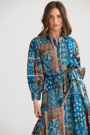 A model wearing the Castella Cotton Dress in colour Sicilian (Blue), from the front, cropped image
