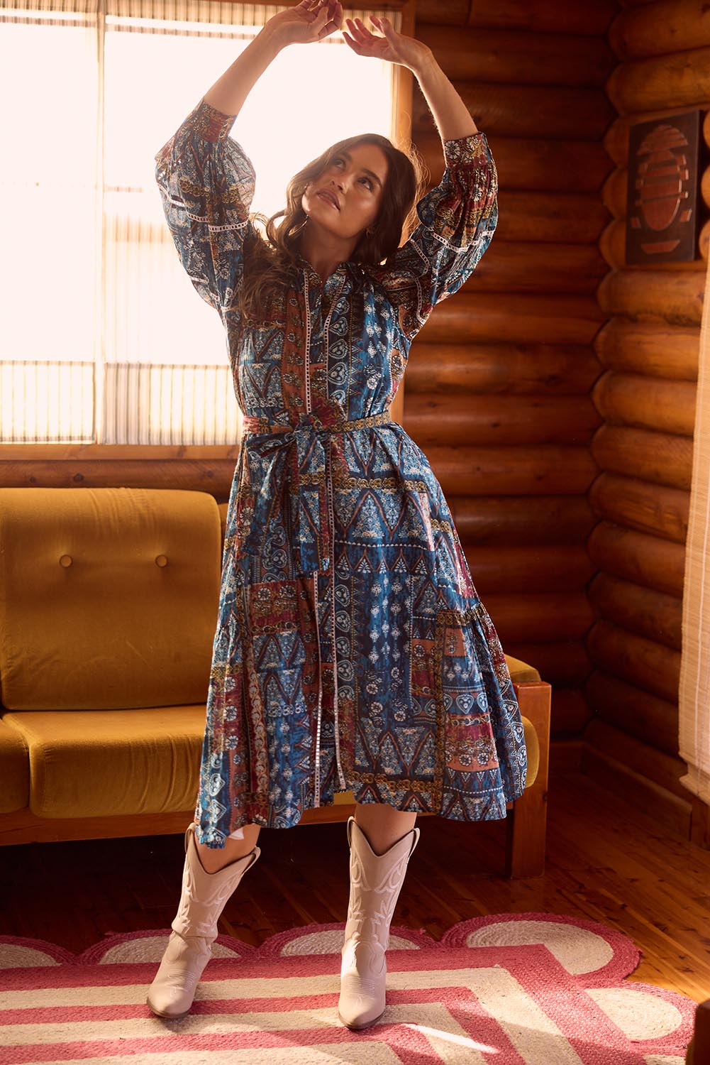 A model wearing the Castella Cotton Dress in colour Sicilian (Blue), from the front, showing the whole outfit