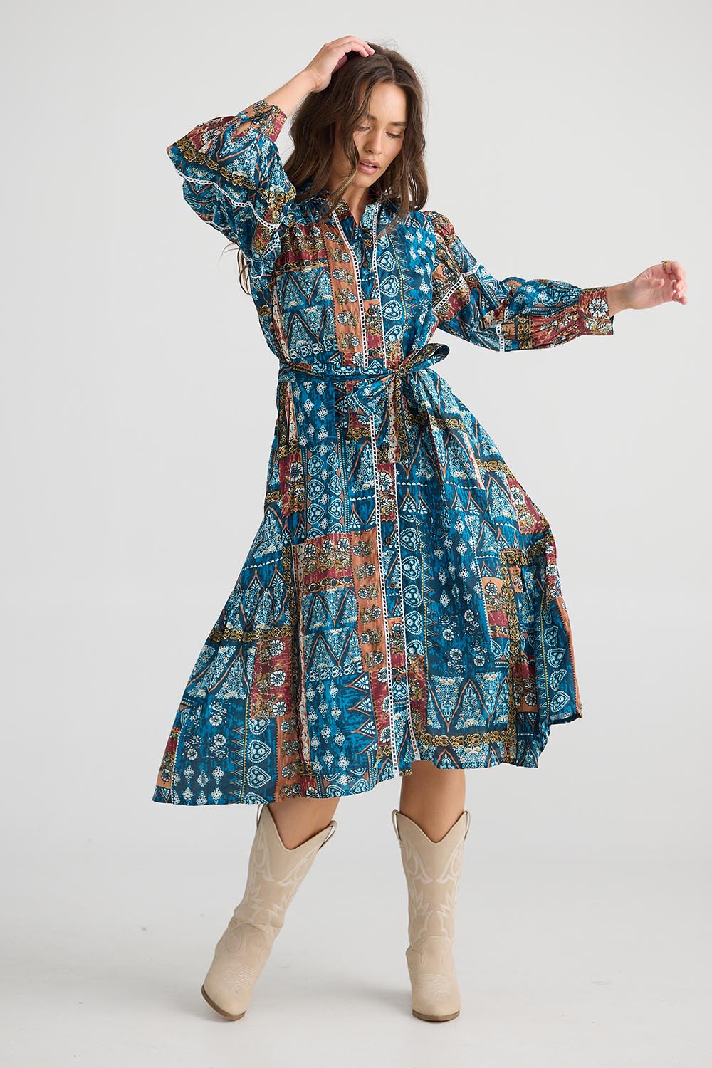 A model wearing the Castella Cotton Dress in colour Sicilian (Blue), from the front, showing the whole outfit