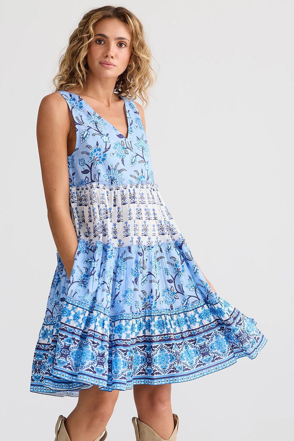 A model wearing the Lucky Charm Cotton Dress in colour Blueberry (Blue), from the front, cropped image