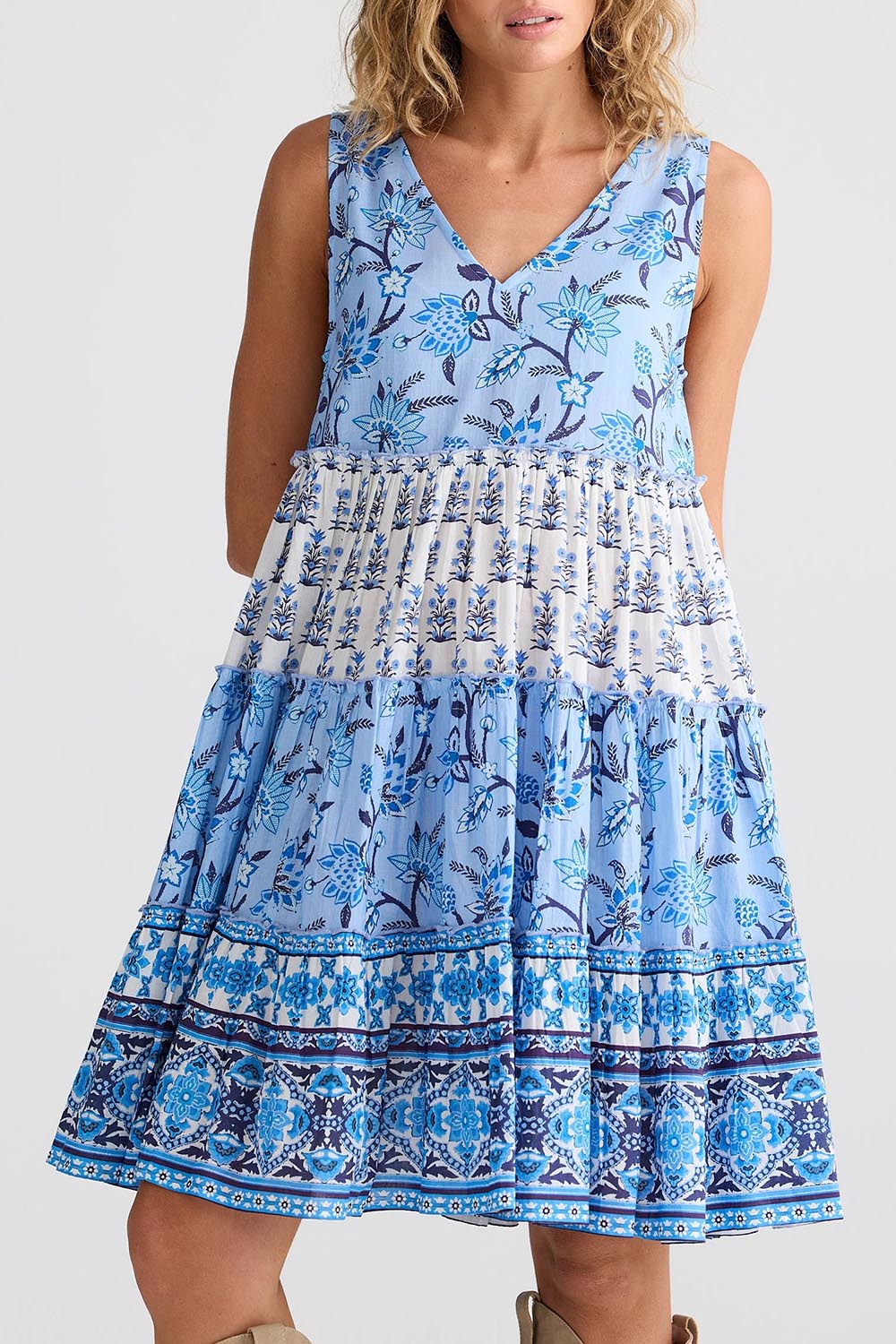 A model wearing the Lucky Charm Cotton Dress in colour Blueberry (Blue), from the front, cropped image