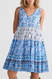 A model wearing the Lucky Charm Cotton Dress in colour Blueberry (Blue), from the front, cropped image
