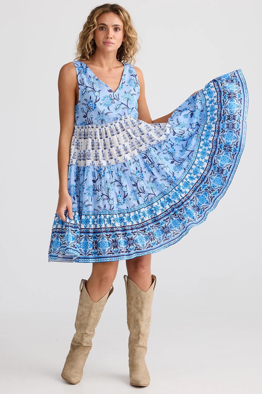 A model wearing the Lucky Charm Cotton Dress in colour Blueberry (Blue), from the front, showing the whole outfit