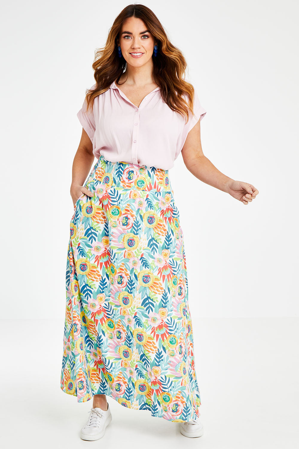 Model Laura wearing the Rosie Maxi Skirt in colour Meadow (Blue), from the front, showing the whole outfit