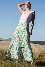 Model Vitoria wearing size 10 of the Rosie Maxi Skirt in colour Meadow (Blue), from the front, showing the whole outfit