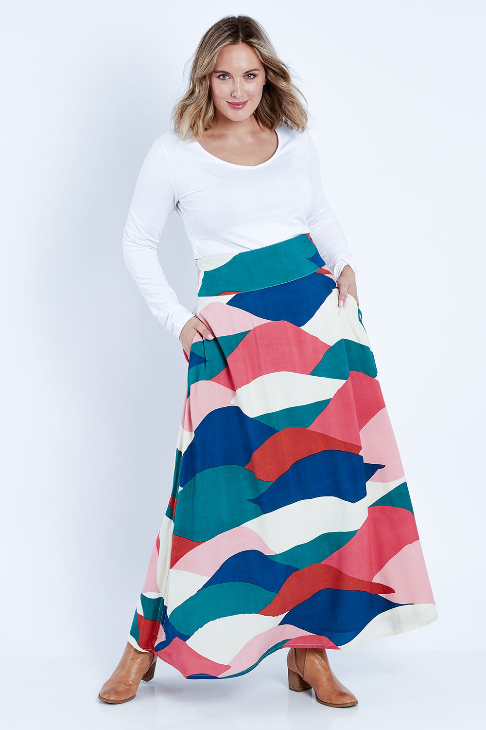 Model Jess wearing size 14 of the Rosie Maxi Skirt in colour Horizon (Pink), from the front, showing the whole outfit