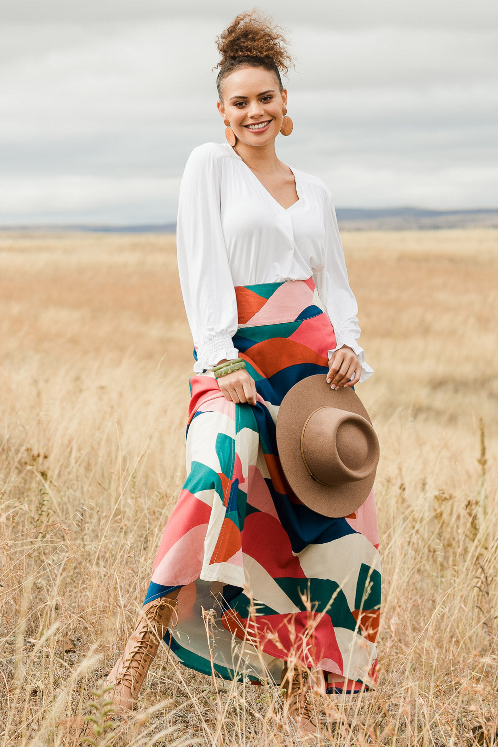 Model Lala wearing size 10 of the Rosie Maxi Skirt in colour Horizon (Pink), from the front, showing the whole outfit