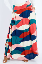 Model Sasha-Lee wearing size 16 of the Rosie Maxi Skirt in colour Horizon (Pink), from the front, cropped image
