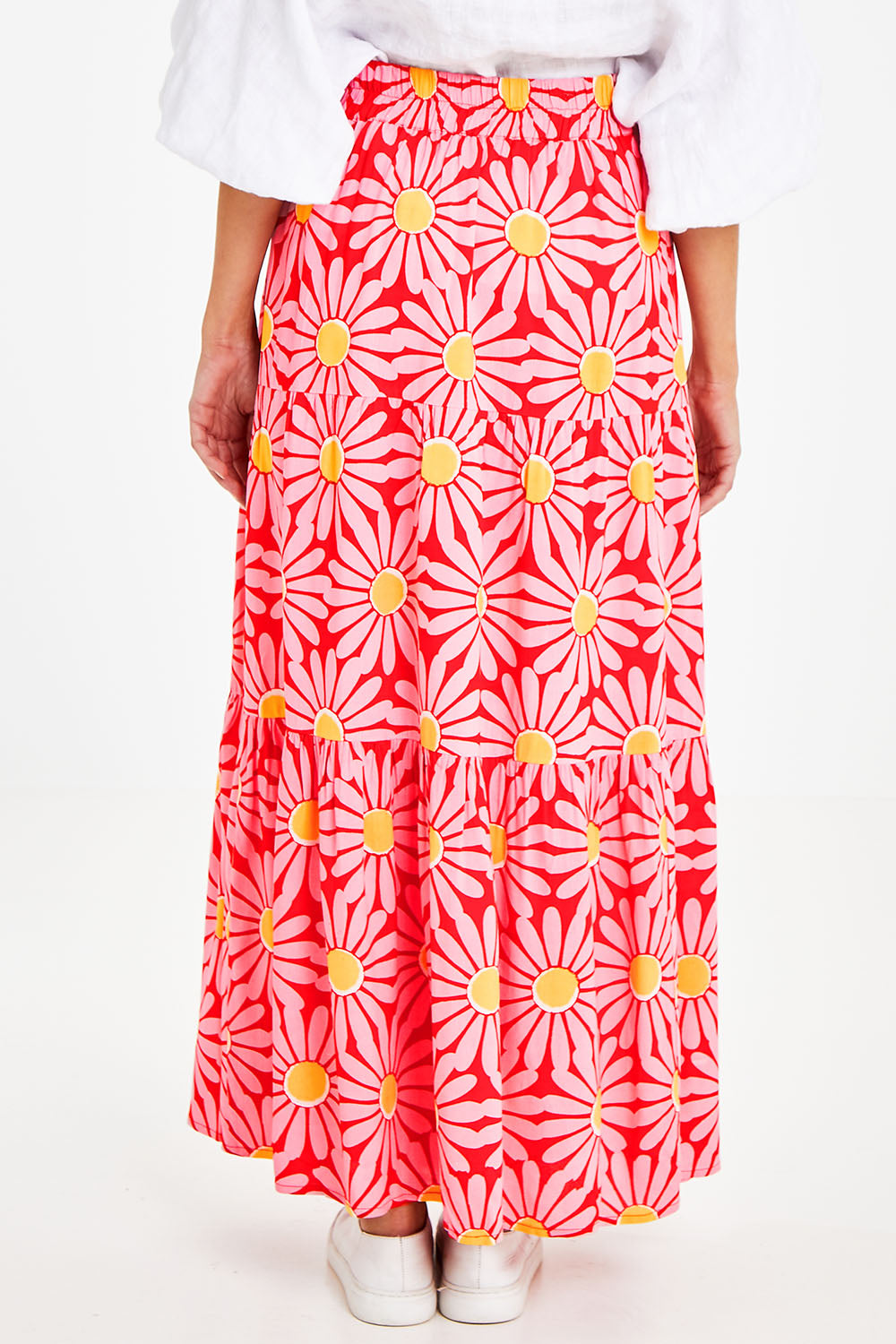 Model Courtney wearing size 10 of the Mallory Tier Skirt in colour Pinkdaisy (Pink), from the back
