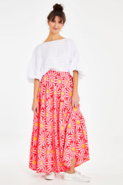 Model Courtney wearing size 10 of the Mallory Tier Skirt in colour Pinkdaisy (Pink), from the front, showing the whole outfit