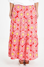 Model Laura wearing size 14 of the Mallory Tier Skirt in colour Pinkdaisy (Pink), from the back