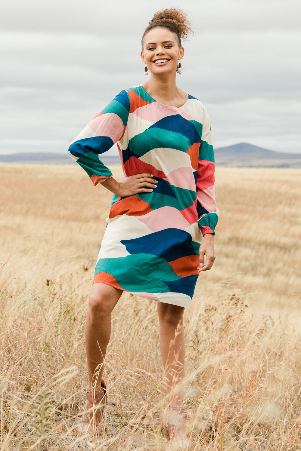 Model Lala wearing size 10 of the Katy Shift Dress in colour Horizon (Pink), from the front, showing the whole outfit
