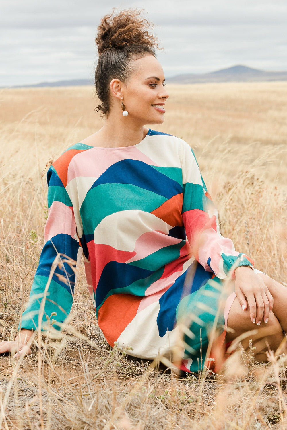 Model Lala wearing size 10 of the Katy Shift Dress in colour Horizon (Pink), from the front, showing the whole outfit