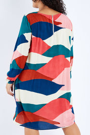 Model Sasha-Lee wearing size 16 of the Katy Shift Dress in colour Horizon (Pink), from the back