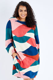 Model Sasha-Lee wearing size 16 of the Katy Shift Dress in colour Horizon (Pink), from the front, cropped image